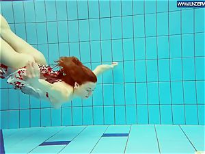 sizzling grind redhead swimming in the pool